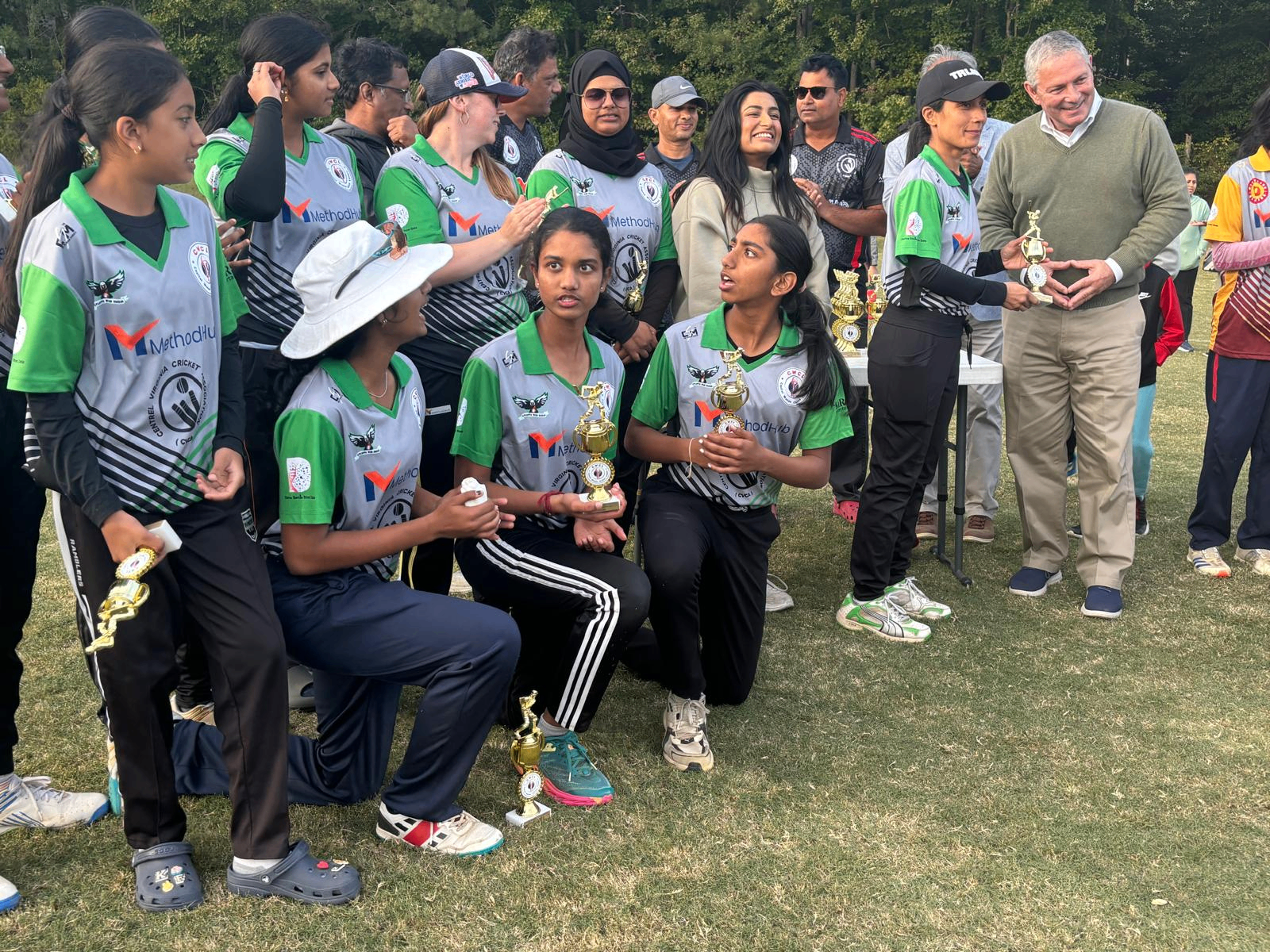 SN Cricket Academy players receiving individual trophies at a youth cricket tournament awards ceremony
